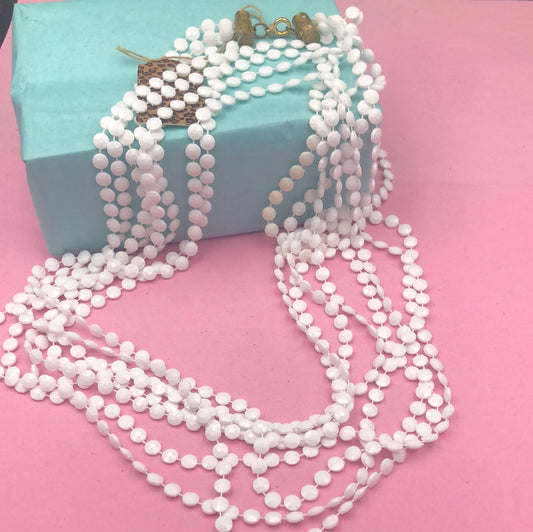 Four strand white necklace