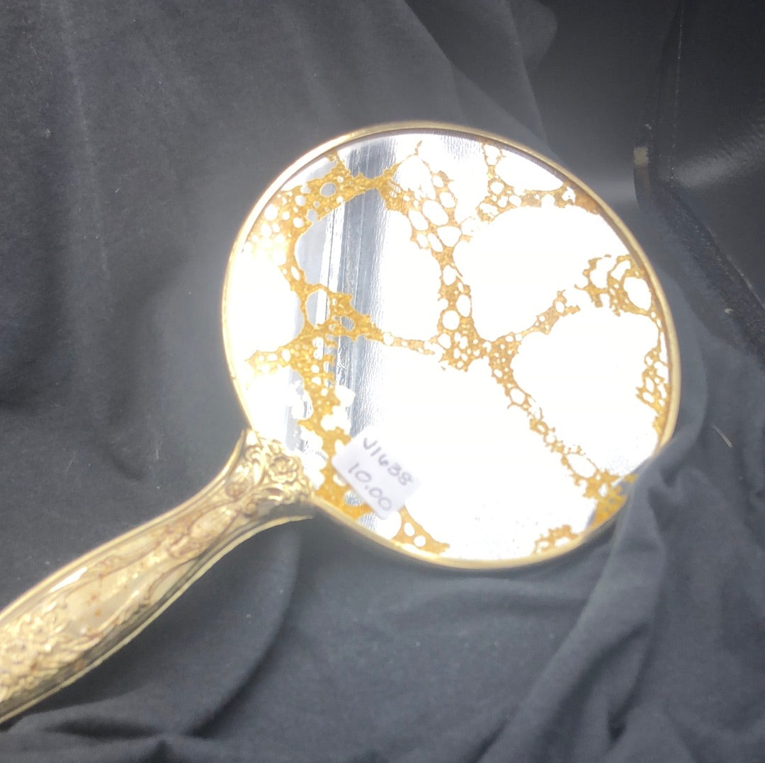 Gold round hand mirror