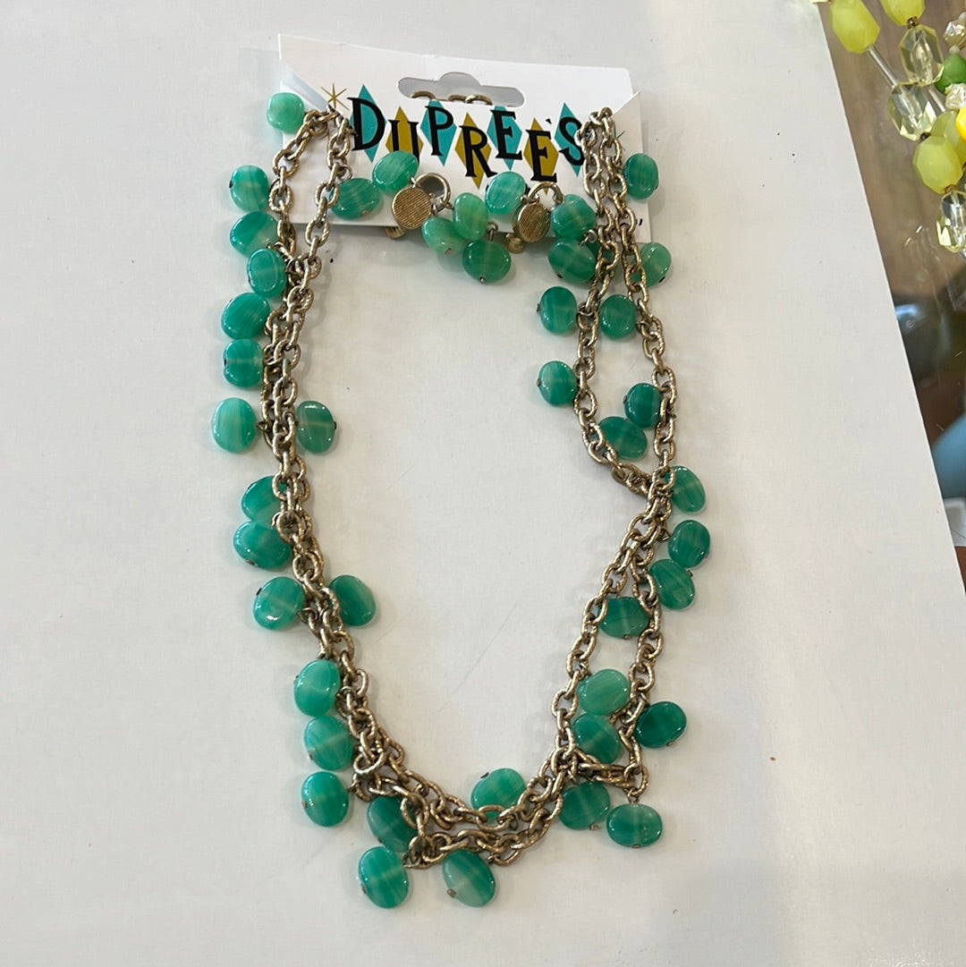 Green stone necklace and matching clip earrings