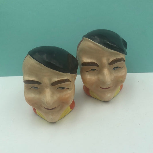 Man with beret salt and pepper shakers