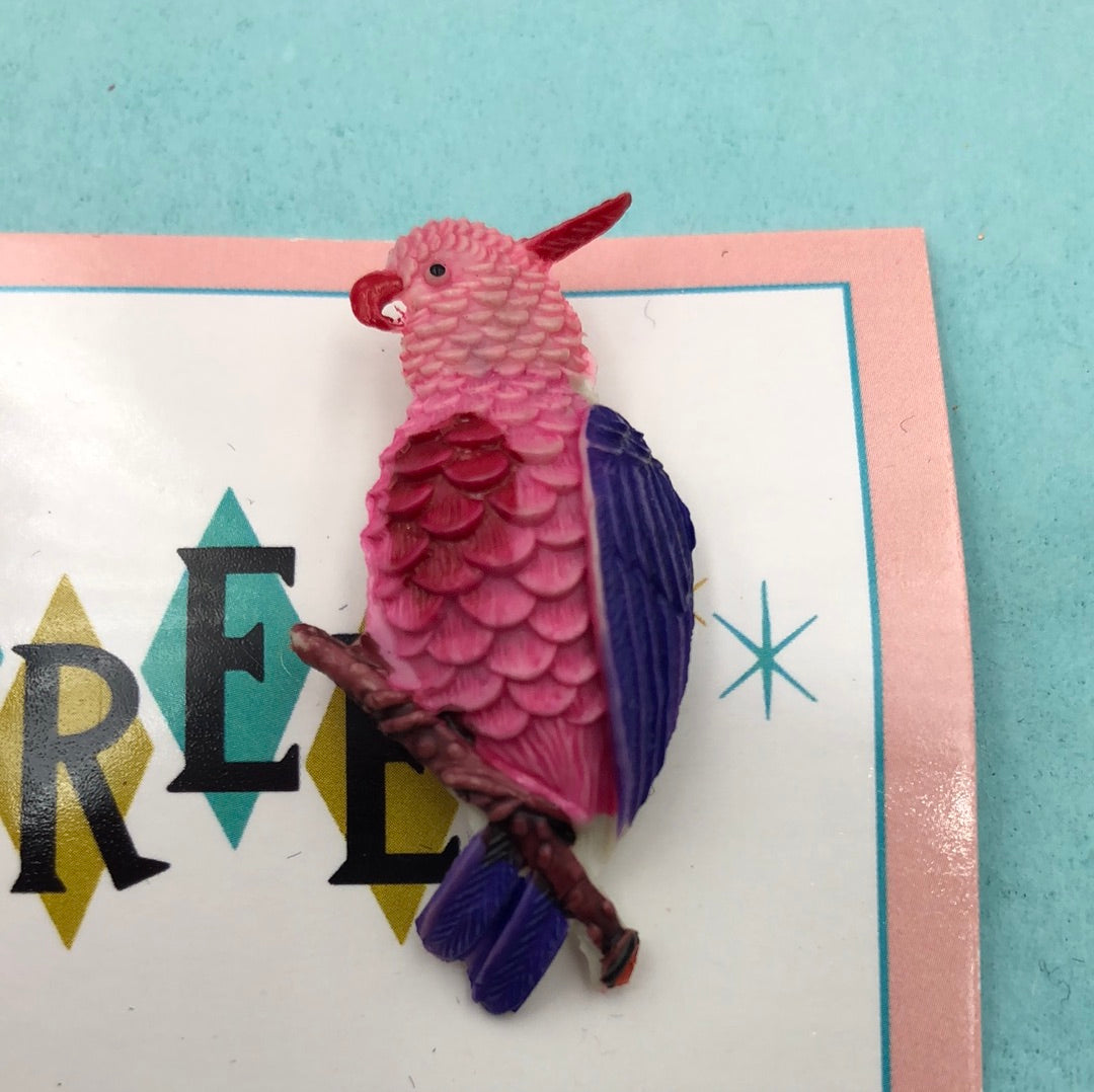 Pink and purple parrot pin