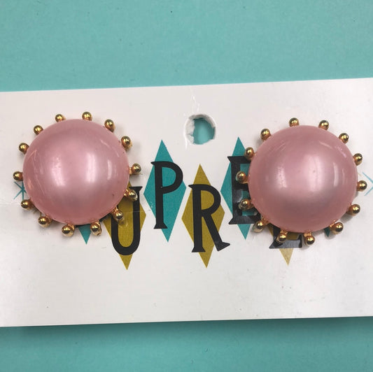 Pink round clip on earrings