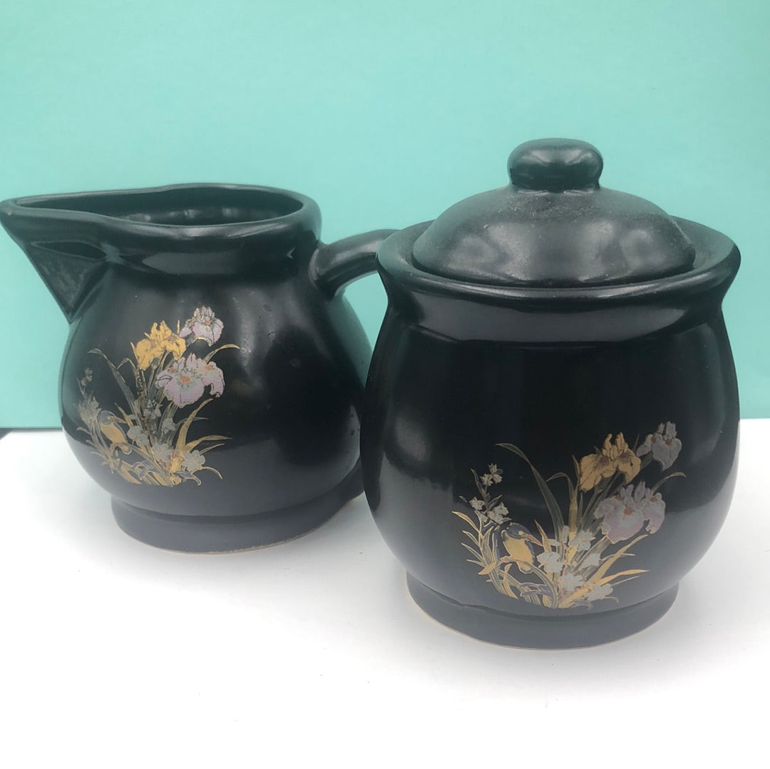 Black ceramic sugar bowl , creamer, and matching salt and pepper shakers